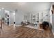 Cozy living room featuring wood floors, built-in shelving, and a fireplace at 24682 E Ontario Dr, Aurora, CO 80016