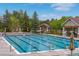 Community pool featuring clear blue water, marked lanes, and surrounding seating areas at 24682 E Ontario Dr, Aurora, CO 80016
