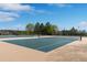 Outdoor tennis courts showcasing well-maintained surfaces, nets, and surrounding fencing at 24682 E Ontario Dr, Aurora, CO 80016
