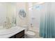 Bathroom featuring a shower-tub combination with tile surround, and a vanity with a marble countertop at 16345 Milwaukee St, Thornton, CO 80602