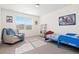 Bright bedroom with natural light, carpet flooring, and a whimsical theme at 16345 Milwaukee St, Thornton, CO 80602