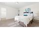Bright bedroom featuring a comfortable bed, soft carpet, and contemporary decor at 16345 Milwaukee St, Thornton, CO 80602