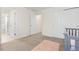Bedroom featuring an open entrance to a closet and a view of a door leading to the bathroom at 16345 Milwaukee St, Thornton, CO 80602