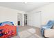 Cozy bedroom with carpet flooring, and ensuite bathroom at 16345 Milwaukee St, Thornton, CO 80602