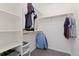 Spacious walk-in closet provides ample storage with shelves and hanging rods at 16345 Milwaukee St, Thornton, CO 80602