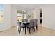 Bright dining room with sliding glass doors leading to the backyard, great for entertaining at 16345 Milwaukee St, Thornton, CO 80602