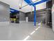 Large three car garage with epoxy flooring, providing ample storage and parking at 16345 Milwaukee St, Thornton, CO 80602
