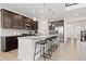 Modern kitchen with a spacious granite island, stainless steel appliances, and pendant lighting at 16345 Milwaukee St, Thornton, CO 80602
