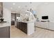 Open concept kitchen with granite countertops, stainless steel appliances, and a large island with seating at 16345 Milwaukee St, Thornton, CO 80602