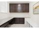Dedicated office space with built-in cabinetry, granite countertops, and ample workspace at 16345 Milwaukee St, Thornton, CO 80602