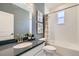 Clean bathroom with white subway tile, shower/tub combo and window at 16551 Peak Way, Broomfield, CO 80023