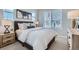 Bright bedroom featuring a comfortable bed and plenty of natural light at 16551 Peak Way, Broomfield, CO 80023