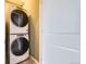 Convenient laundry room with stacked Whirlpool washer and dryer at 16551 Peak Way, Broomfield, CO 80023