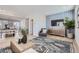 Open concept living room with stylish furnishings and a feature wall at 16551 Peak Way, Broomfield, CO 80023