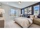 Spacious main bedroom with a calming color palette and large window at 16551 Peak Way, Broomfield, CO 80023