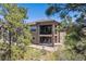 Scenic backyard featuring a charming balcony and a serene outdoor setting, perfect for relaxation at 438 Galaxy Dr, Castle Rock, CO 80108