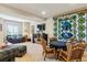 Spacious basement featuring comfortable seating, a TV, and a decorative quilt at 438 Galaxy Dr, Castle Rock, CO 80108