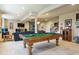 Finished basement with a pool table, entertainment area, and cozy furnishings at 438 Galaxy Dr, Castle Rock, CO 80108