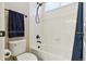 Bright bathroom features a white tiled shower and tub with a black shower head and towel rack at 438 Galaxy Dr, Castle Rock, CO 80108