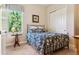 A guest bedroom featuring a window with bright light, custom window coverings and a bed at 438 Galaxy Dr, Castle Rock, CO 80108