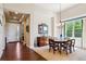 Bright dining room featuring hardwood floors, a custom sideboard, and a view into the entryway at 438 Galaxy Dr, Castle Rock, CO 80108