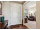 Inviting foyer with hardwood floors, a decorative front door, and a view into the home office at 438 Galaxy Dr, Castle Rock, CO 80108