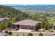 Beautiful home with a three-car garage, lush landscaping, and mountain views at 438 Galaxy Dr, Castle Rock, CO 80108