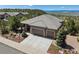 Charming exterior featuring a three-car garage, elegant stone accents, and professional landscaping at 438 Galaxy Dr, Castle Rock, CO 80108