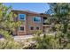 Stunning shot of the rear exterior showcasing the architectural design and outdoor space at 438 Galaxy Dr, Castle Rock, CO 80108