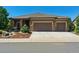 Charming home exterior with a well-maintained lawn, stone accents, and a two-car garage at 438 Galaxy Dr, Castle Rock, CO 80108