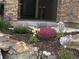 Professionally landscaped front yard with mature plants, rock water feature and a charming moose statue at 438 Galaxy Dr, Castle Rock, CO 80108