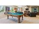 Large game room boasts a pool table, entertainment center, and comfy seating at 438 Galaxy Dr, Castle Rock, CO 80108