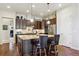 Contemporary kitchen featuring a central island, pendant lighting, and dark cabinets at 438 Galaxy Dr, Castle Rock, CO 80108