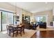 Open concept living space with large windows, hardwood floors, and access to outdoor spaces at 438 Galaxy Dr, Castle Rock, CO 80108
