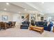 Large living area with comfy seating, a wooden table, and access to billiards and upper level at 438 Galaxy Dr, Castle Rock, CO 80108