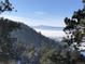 Beautiful mountain home view above a blanket of low-lying fog at 438 Galaxy Dr, Castle Rock, CO 80108