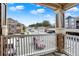 Balcony view of the parking area and surrounding buildings on a bright day at 7440 S Blackhawk St # 16-208, Englewood, CO 80112