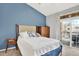 Comfortable bedroom with a private balcony and lots of natural light at 7440 S Blackhawk St # 16-208, Englewood, CO 80112
