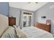 Bright bedroom with natural light from the sliding door at 7440 S Blackhawk St # 16-208, Englewood, CO 80112