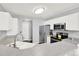 Cozy kitchen featuring a stainless steel refrigerator and modern appliances at 7440 S Blackhawk St # 16-208, Englewood, CO 80112