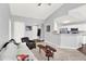 Open concept living area flowing into a kitchen with bar seating at 7440 S Blackhawk St # 16-208, Englewood, CO 80112