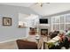Bright living room featuring a fireplace, open layout, and neutral color scheme at 7440 S Blackhawk St # 16-208, Englewood, CO 80112