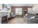 Cozy living room with stone fireplace and hardwood floors at 6566 S Elm Cir, Centennial, CO 80121