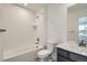 Full bathroom with tub and shower, vanity, and neutral color scheme at 98 Wooten Ave, Brighton, CO 80601