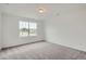 Cozy bedroom with a large window offering plenty of natural light at 98 Wooten Ave, Brighton, CO 80601