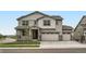 Charming two-story home with a two car garage and landscaped front yard at 98 Wooten Ave, Brighton, CO 80601