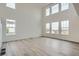 Bright, airy living room featuring high ceilings and lots of natural light at 98 Wooten Ave, Brighton, CO 80601