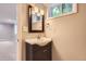 Elegant bathroom features a sleek vanity, stylish mirror, and modern fixtures at 2531 S Hoyt Ct, Lakewood, CO 80227