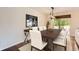 Dining space with modern table, pendant lighting, and sliding glass door to the patio at 2531 S Hoyt Ct, Lakewood, CO 80227