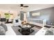Bright and airy living room with modern furniture and stylish decor at 2531 S Hoyt Ct, Lakewood, CO 80227
